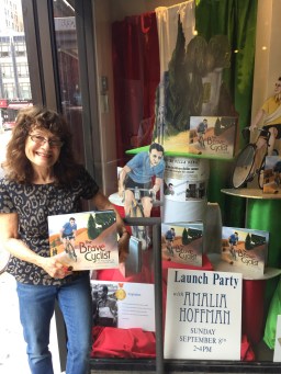 standing in front of Books of Wonder window