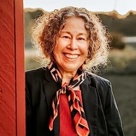 cropped headshot at barn for Amazon author page
